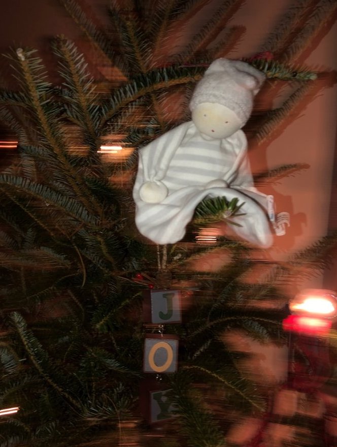 UpChoose toys as ornaments in Christmas tree
